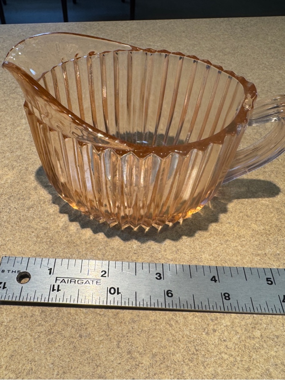 Pink depression glass creamer in 'Queen Mary' pattern by Anchor Hocking